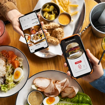 Team defining project requirements around a laptop